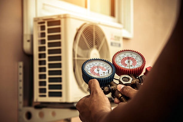 Professional Air Conditioning Service technician working in Churchville, NY